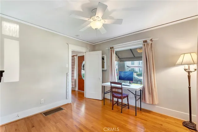 a view of a livingroom with furniture and a workspace