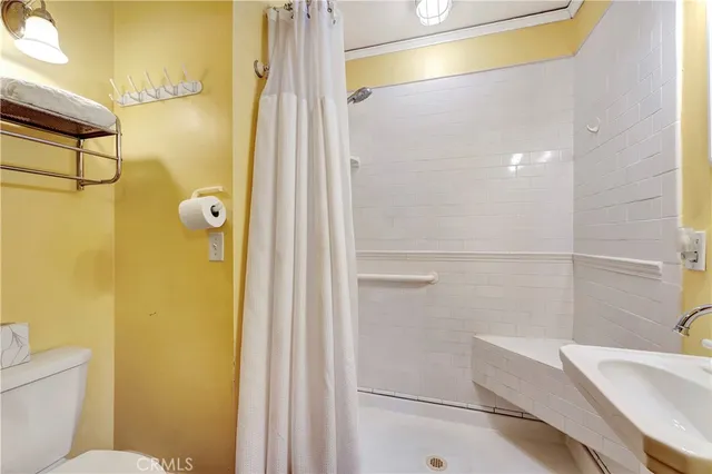 a bathroom with a tub and shower