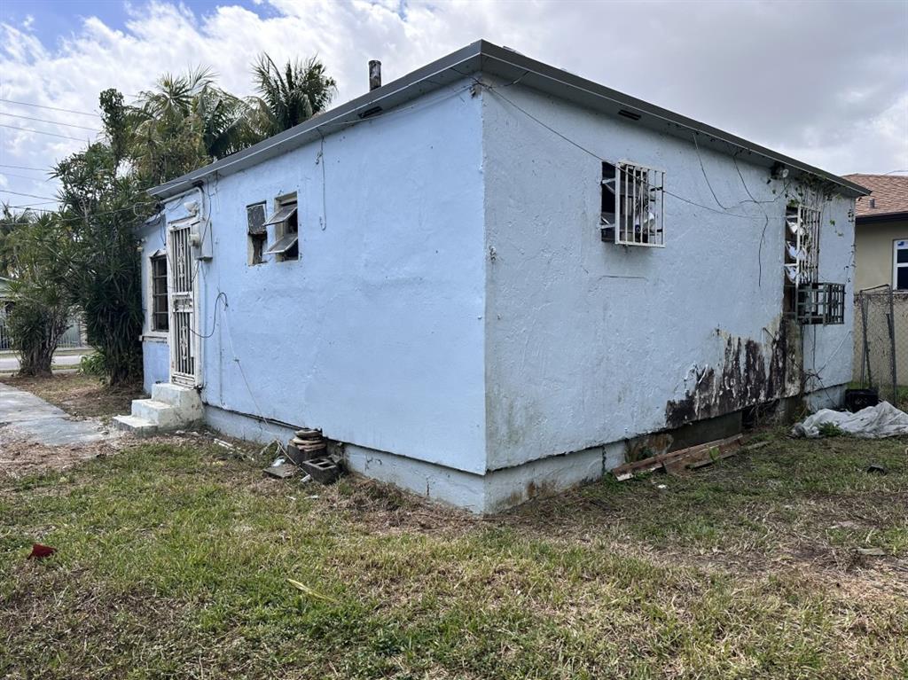 2161 Northwest 50th Street Miami, FL 33142 - Photo 4 of 4 a backyard of a house
