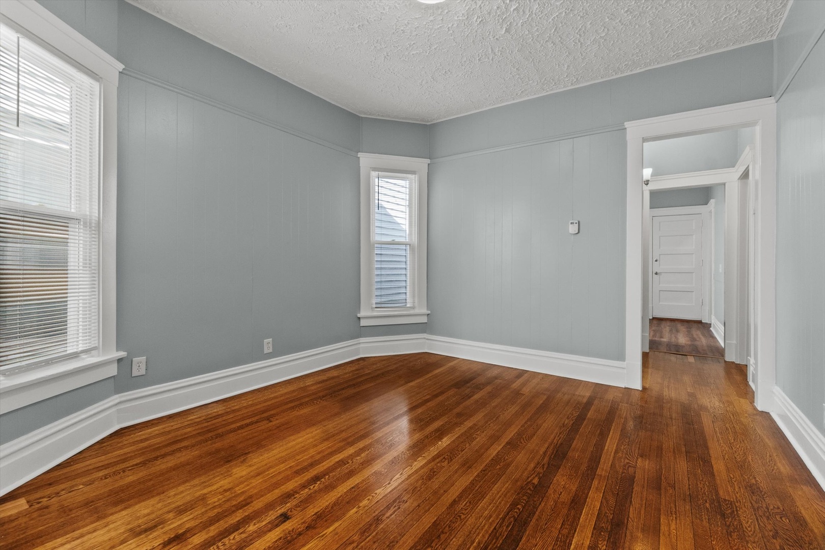 820 East 89th Place, Unit 2 Chicago, IL 60619 - Photo 11 of 15 a view of empty room with wooden floor and fan