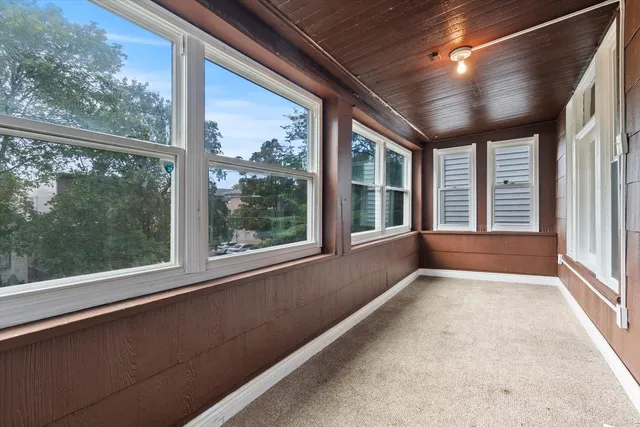 a view of an empty room with a large window