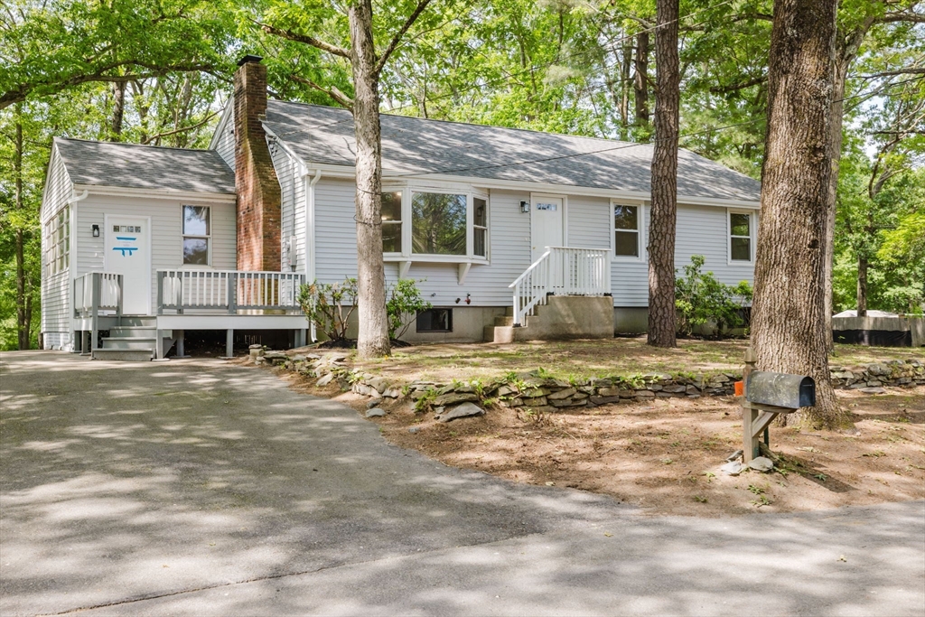 24 Sagamore Road Attleboro, MA 02703 - Photo 1 of 39 a front view of a house with a yard and large trees