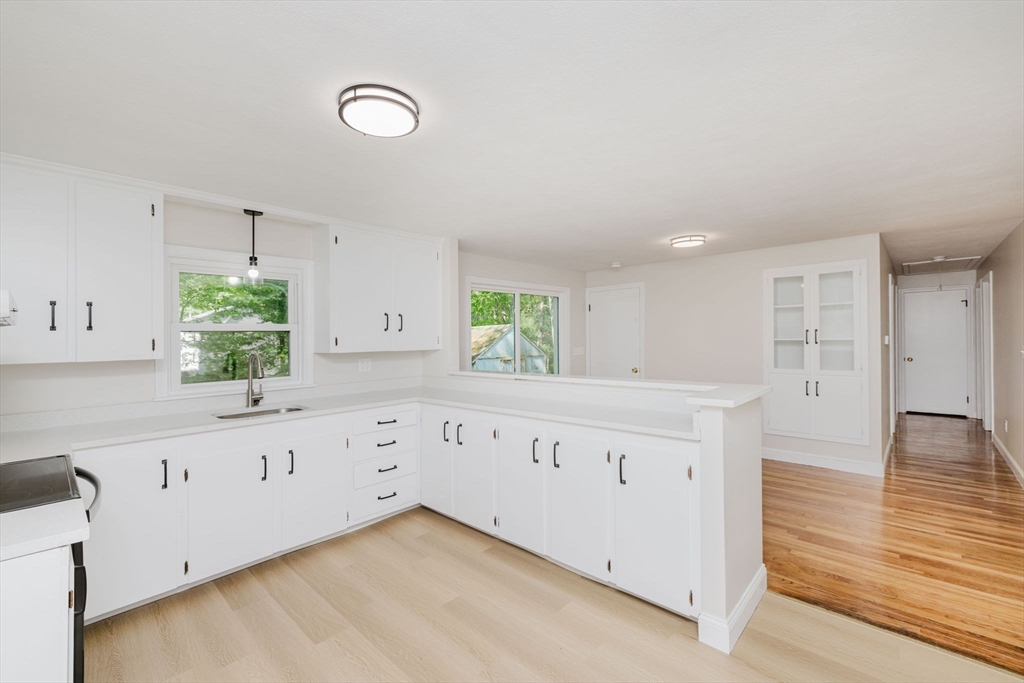 24 Sagamore Road Attleboro, MA 02703 - Photo 18 of 39 a kitchen with granite countertop white cabinets and window
