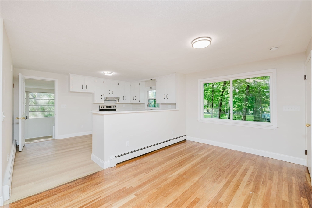 24 Sagamore Road Attleboro, MA 02703 - Photo 19 of 39 a view of kitchen with wooden floor and window