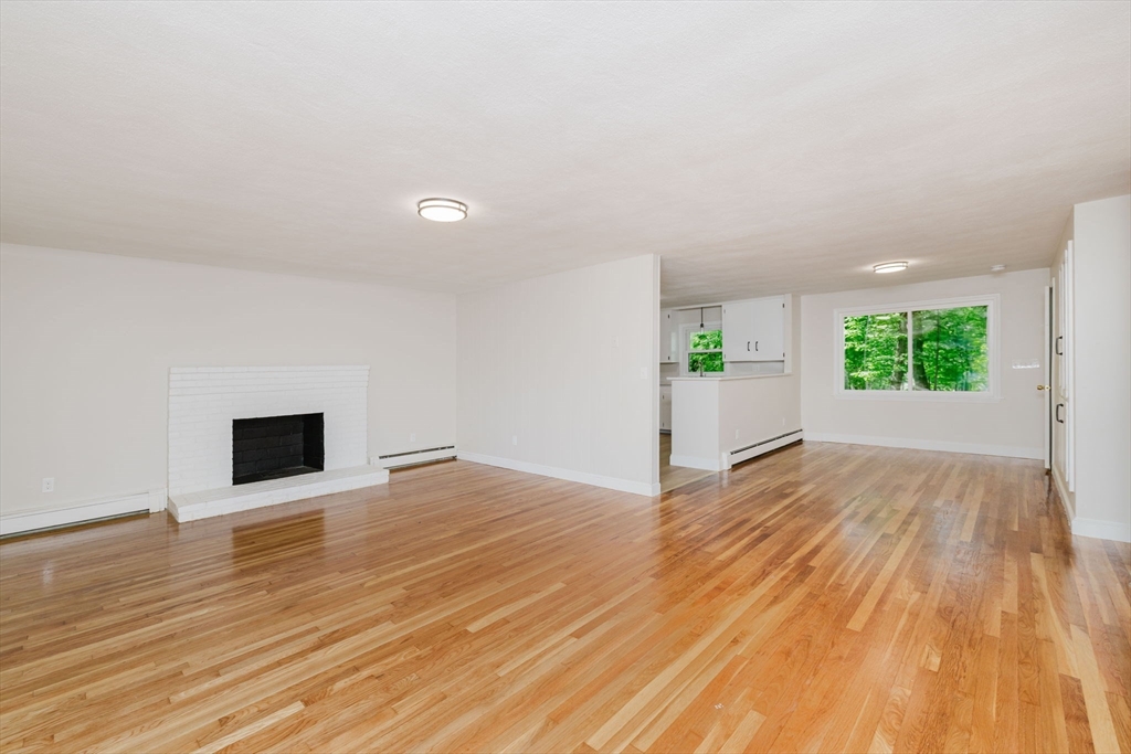 24 Sagamore Road Attleboro, MA 02703 - Photo 23 of 39 wooden floor in an empty room with a window