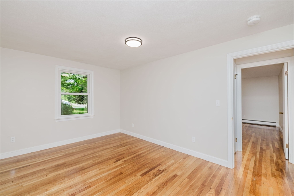 24 Sagamore Road Attleboro, MA 02703 - Photo 25 of 39 an empty room with wooden floor and windows