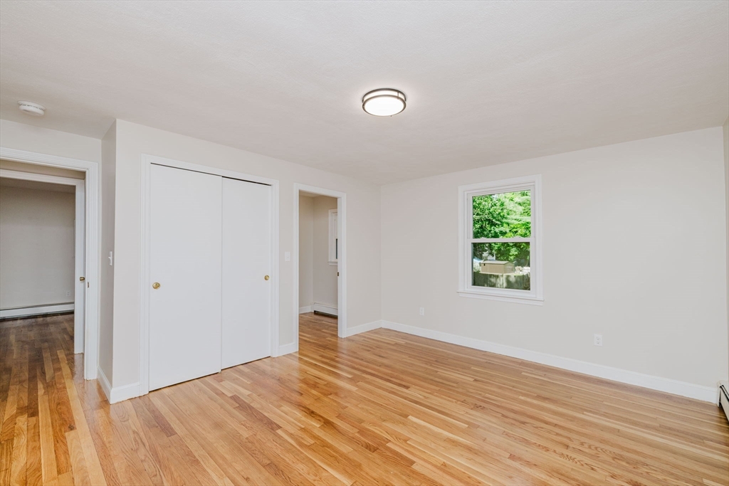 24 Sagamore Road Attleboro, MA 02703 - Photo 26 of 39 an empty room with wooden floor and windows