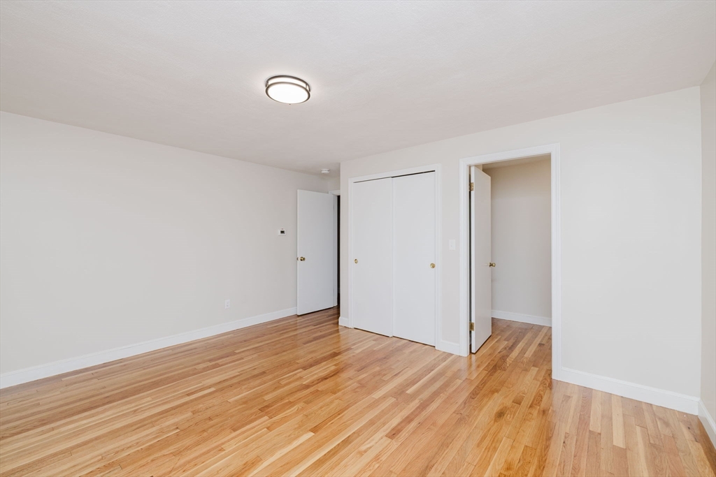 24 Sagamore Road Attleboro, MA 02703 - Photo 27 of 39 a view of an empty room and wooden floor