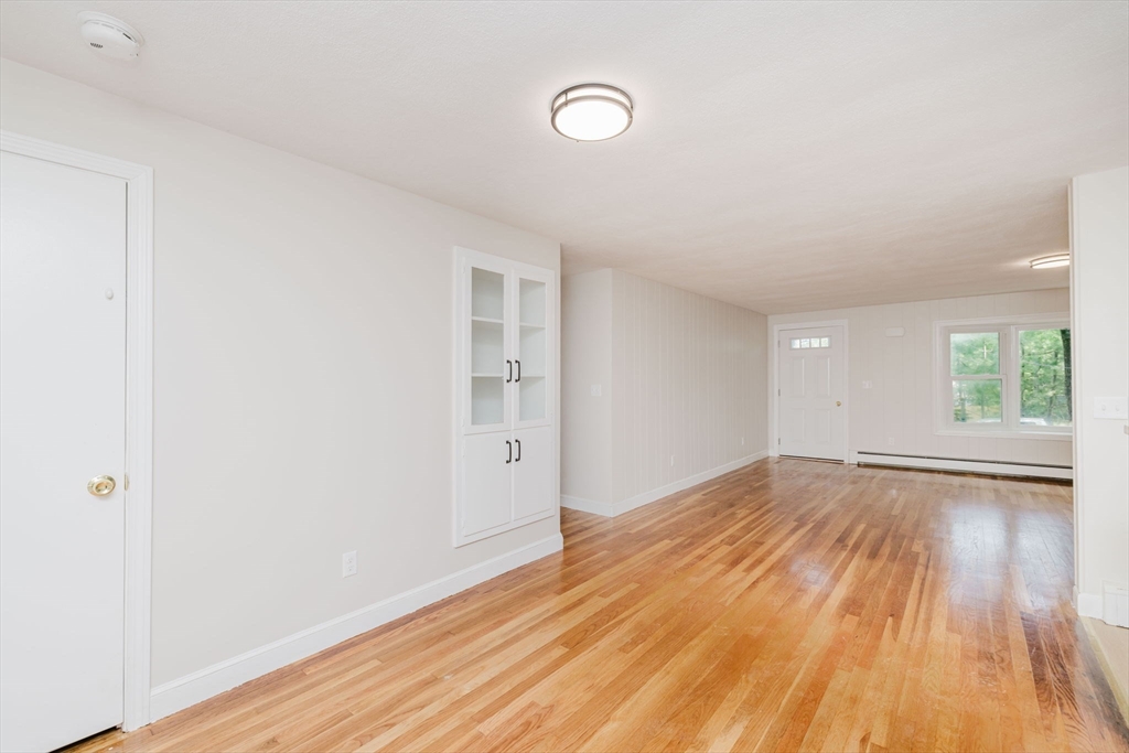 24 Sagamore Road Attleboro, MA 02703 - Photo 32 of 39 an empty room with wooden floor and windows