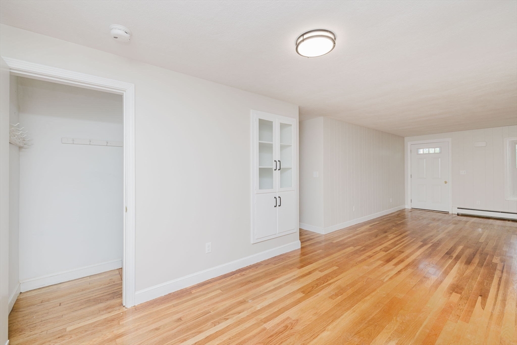 24 Sagamore Road Attleboro, MA 02703 - Photo 34 of 39 an empty room with wooden floor and windows