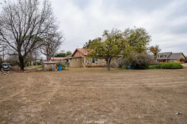 a view of road with large trees
