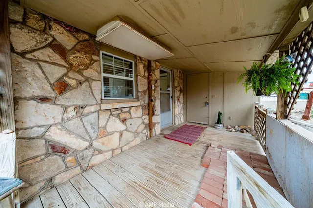 a bedroom with a bed and a potted plant