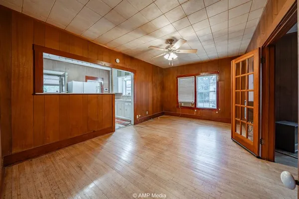 wooden floor in an empty room with a window