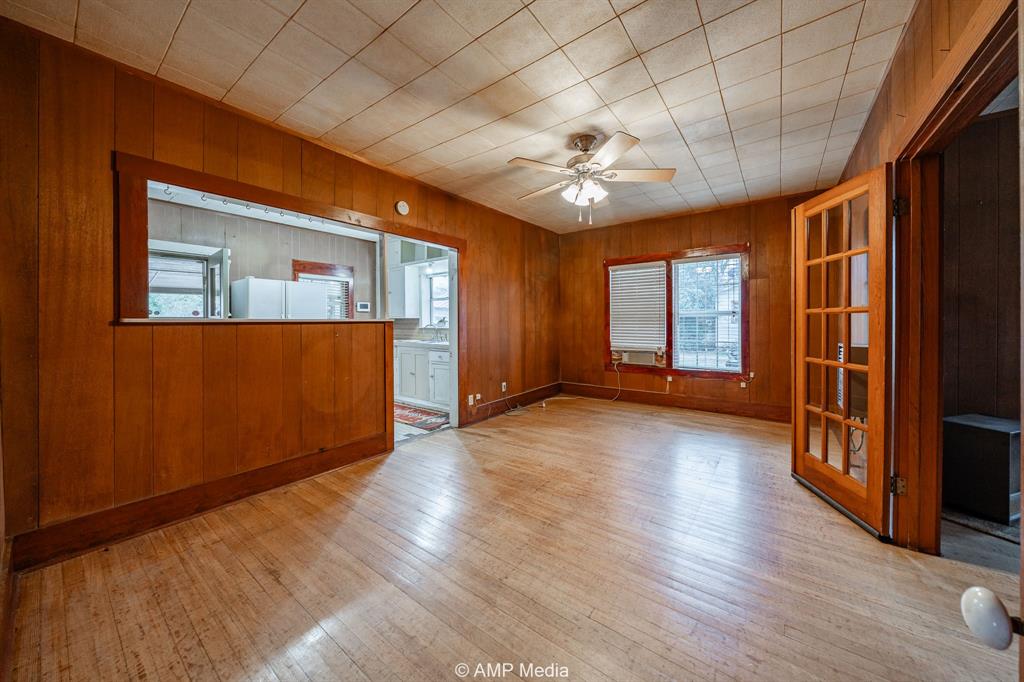 1104 North Avenue Avenue East Haskell, TX 79521 - Photo 6 of 30 wooden floor in an empty room with a window