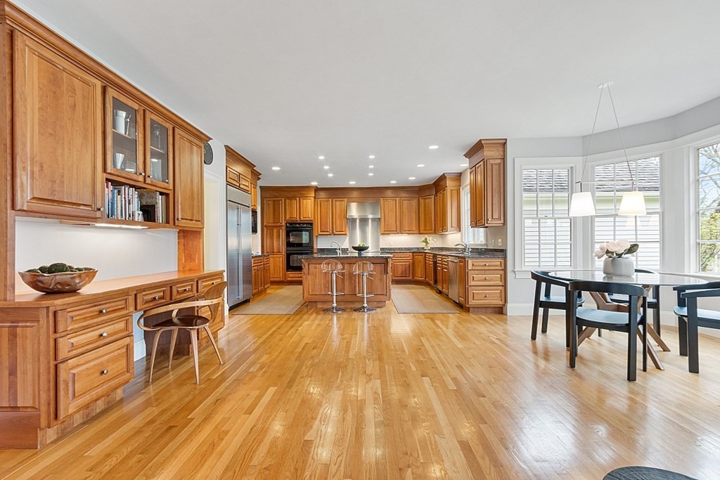 257 Nashoba Road Concord, MA 01742 - Photo 11 of 41 a living room with stainless steel appliances furniture wooden floor and a kitchen view