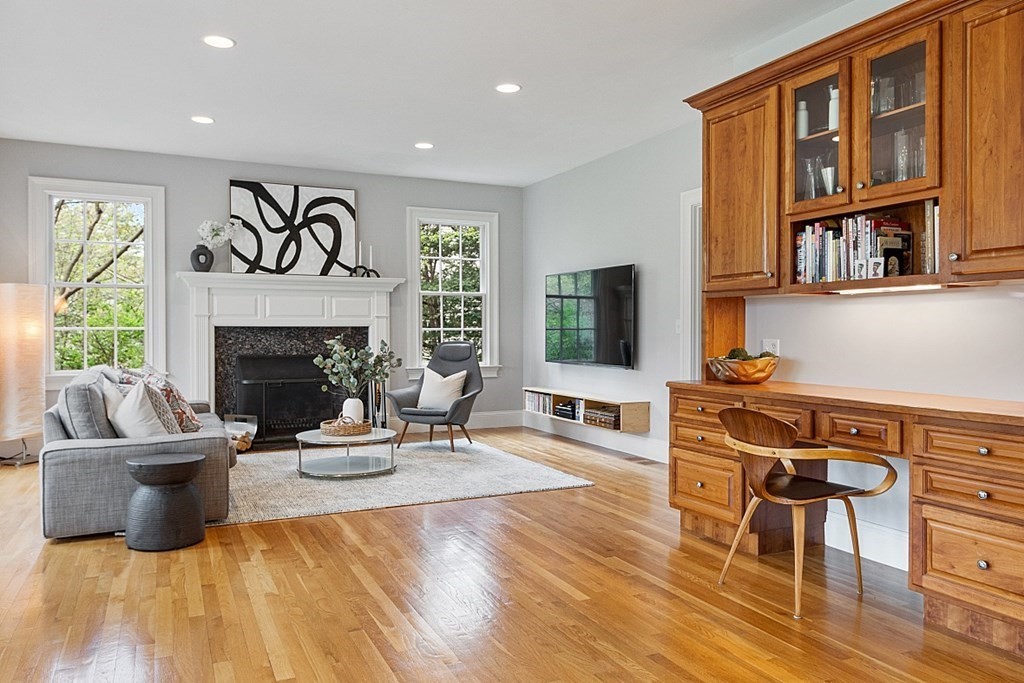 257 Nashoba Road Concord, MA 01742 - Photo 14 of 41 a living room with furniture a window and a fireplace