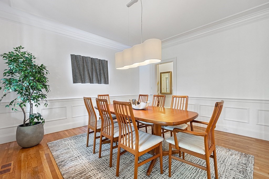 257 Nashoba Road Concord, MA 01742 - Photo 18 of 41 a view of a dining room with furniture and wooden floor