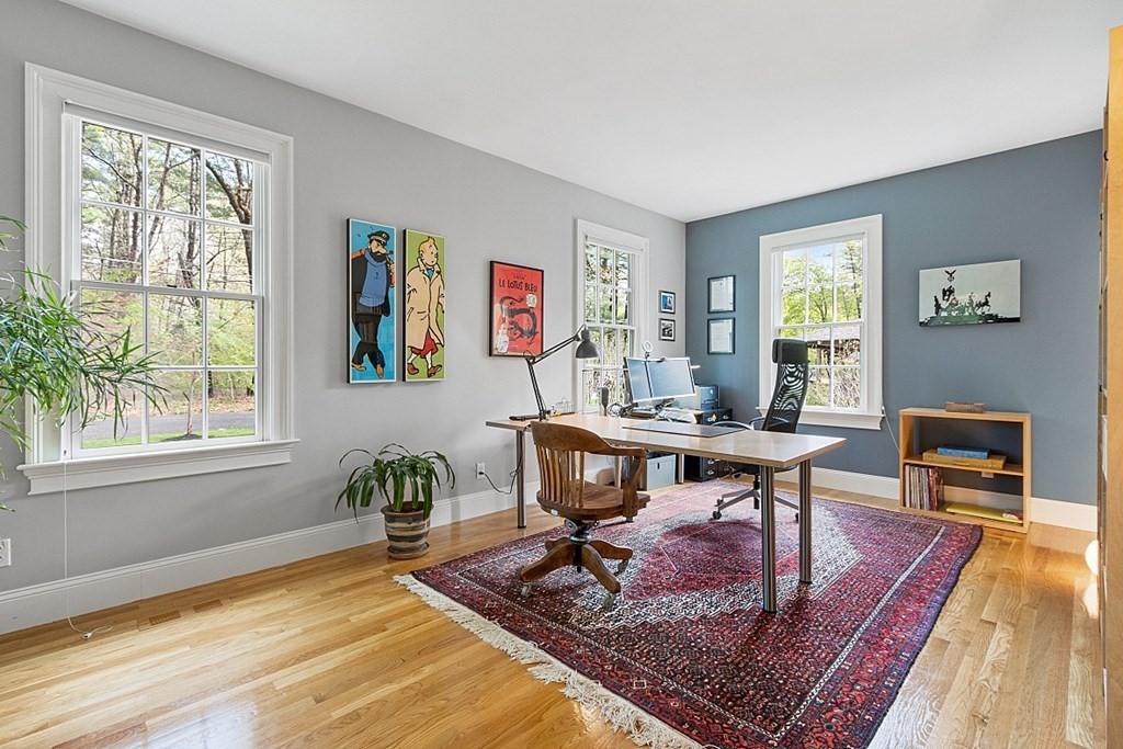 257 Nashoba Road Concord, MA 01742 - Photo 19 of 41 a living room with furniture a rug and a window
