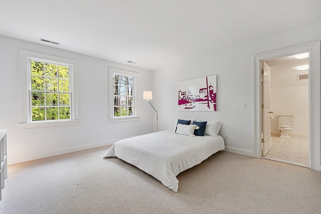 257 Nashoba Road Concord, MA 01742 - Photo 24 of 41 a bedroom with a bed and a large window