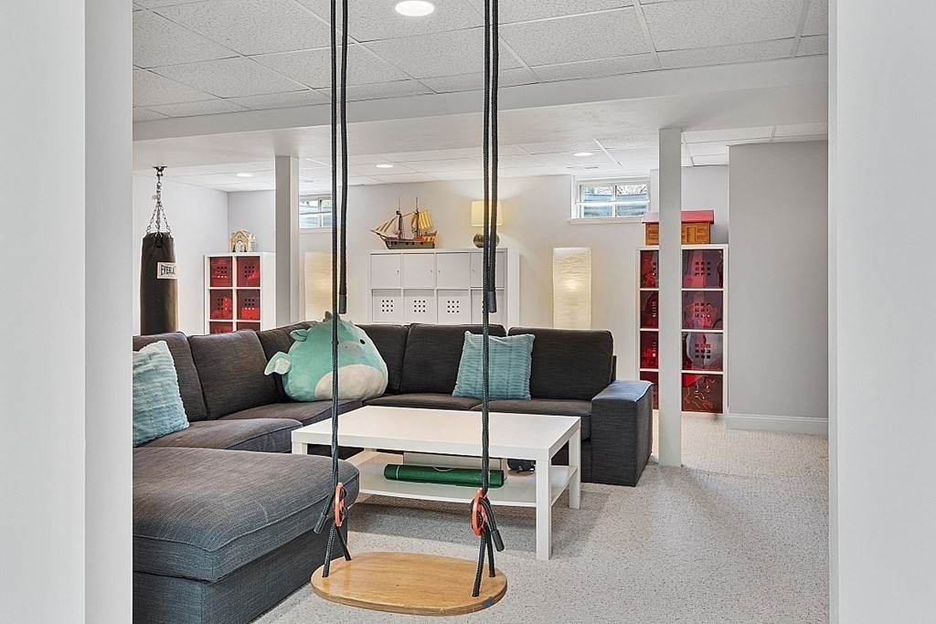 257 Nashoba Road Concord, MA 01742 - Photo 31 of 41 a living room with furniture and a potted plant