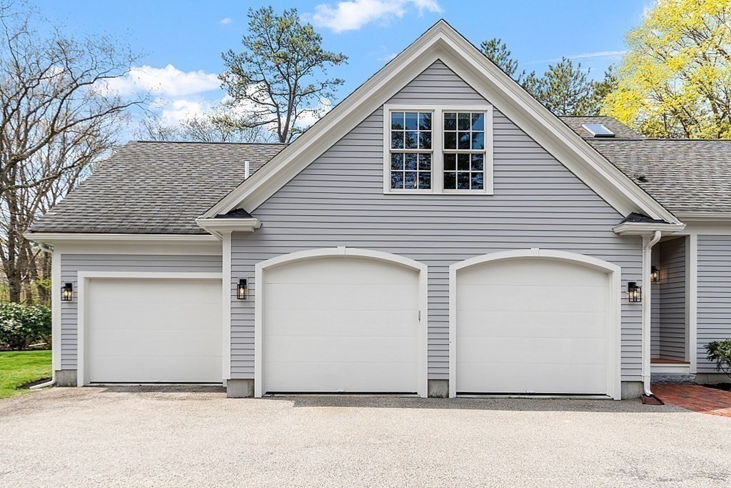 257 Nashoba Road Concord, MA 01742 - Photo 37 of 41 a view of a small house with garage