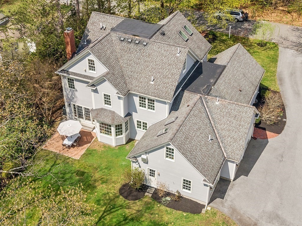 257 Nashoba Road Concord, MA 01742 - Photo 39 of 41 an aerial view of a house with outdoor space and a lake view