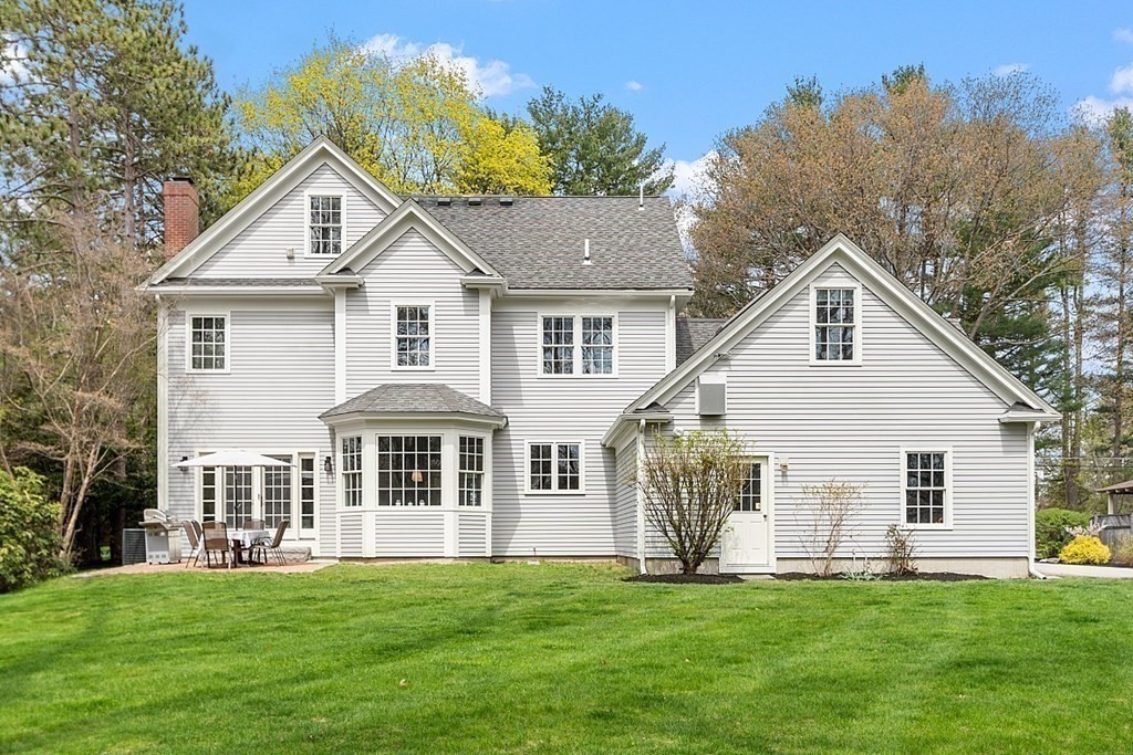 257 Nashoba Road Concord, MA 01742 - Photo 4 of 41 a front view of a house with a garden