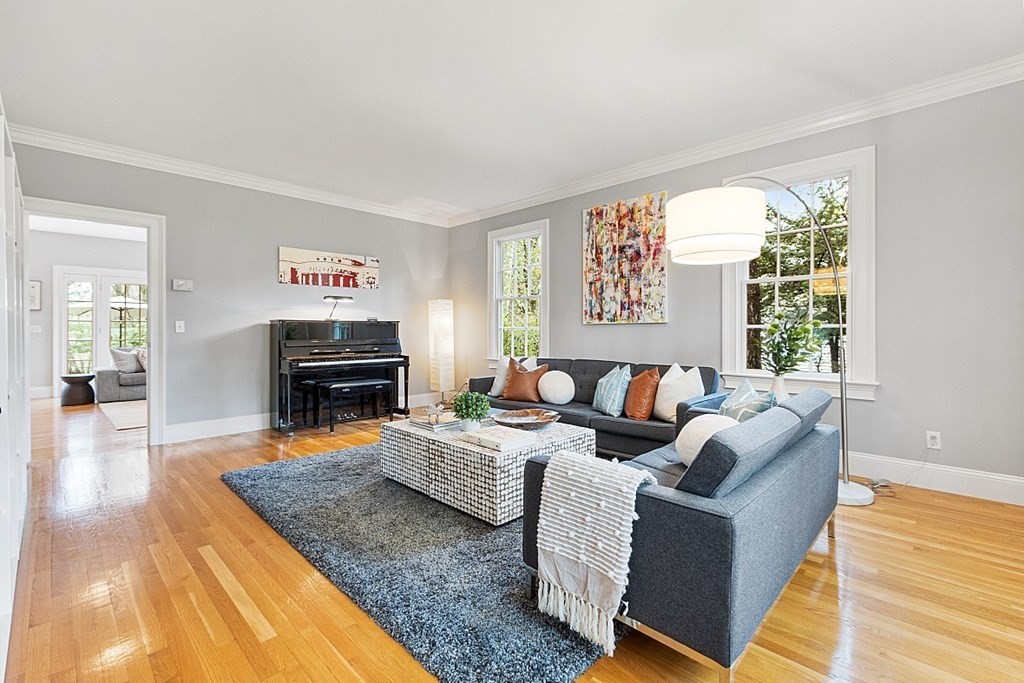 257 Nashoba Road Concord, MA 01742 - Photo 8 of 41 a living room with fireplace furniture and a rug