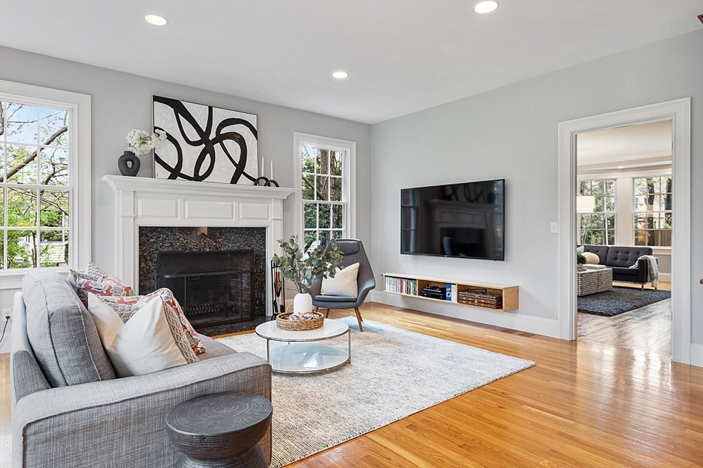 257 Nashoba Road Concord, MA 01742 - Photo 10 of 41 a living room with furniture and a flat screen tv
