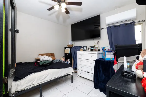 a room with furniture and a flat screen tv