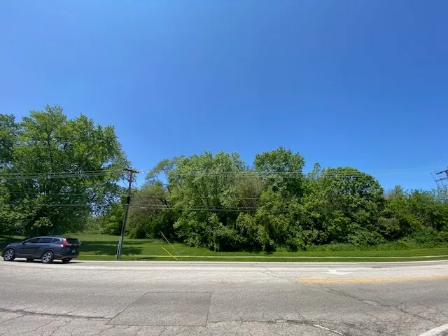 a view of a road with a building in the background