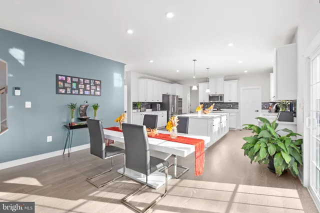 a bedroom with furniture and a flat screen tv