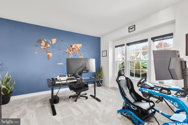 a bedroom with a bed and view of living room