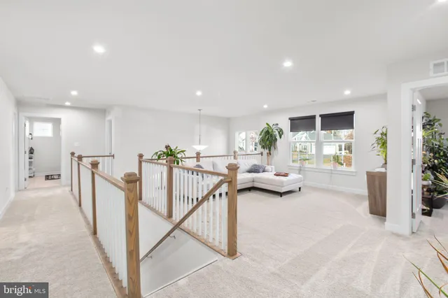 a bedroom with a bed and a potted plant