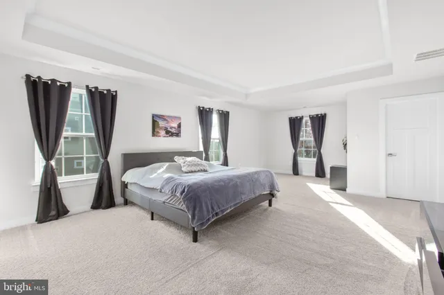 a bathroom with a shower and a sink
