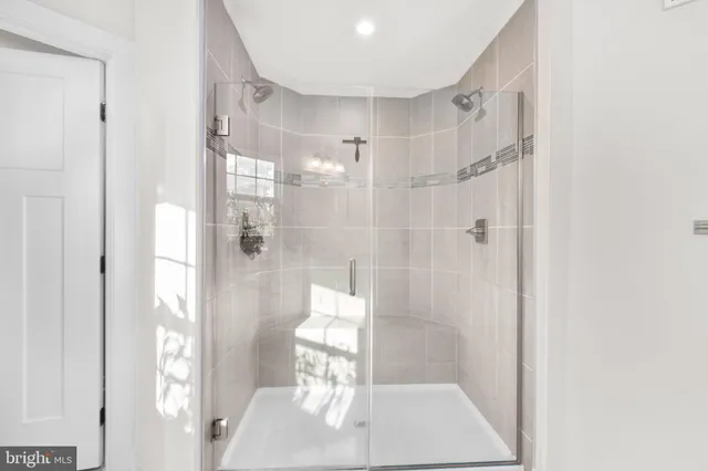 a living room with furniture a flat screen tv and a table