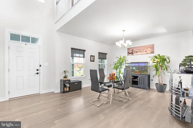 a kitchen with stainless steel appliances kitchen island granite countertop a sink a stove and refrigerator