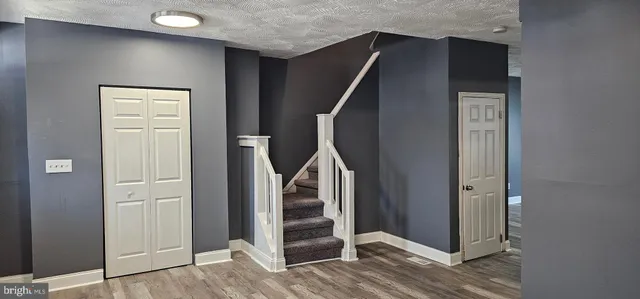 a view of entryway with wooden floor