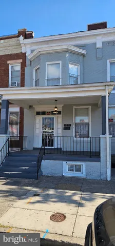 a view of a building with car parked
