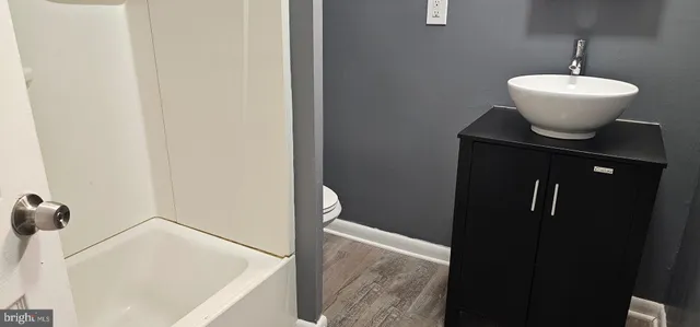a bathroom with a sink and mirror