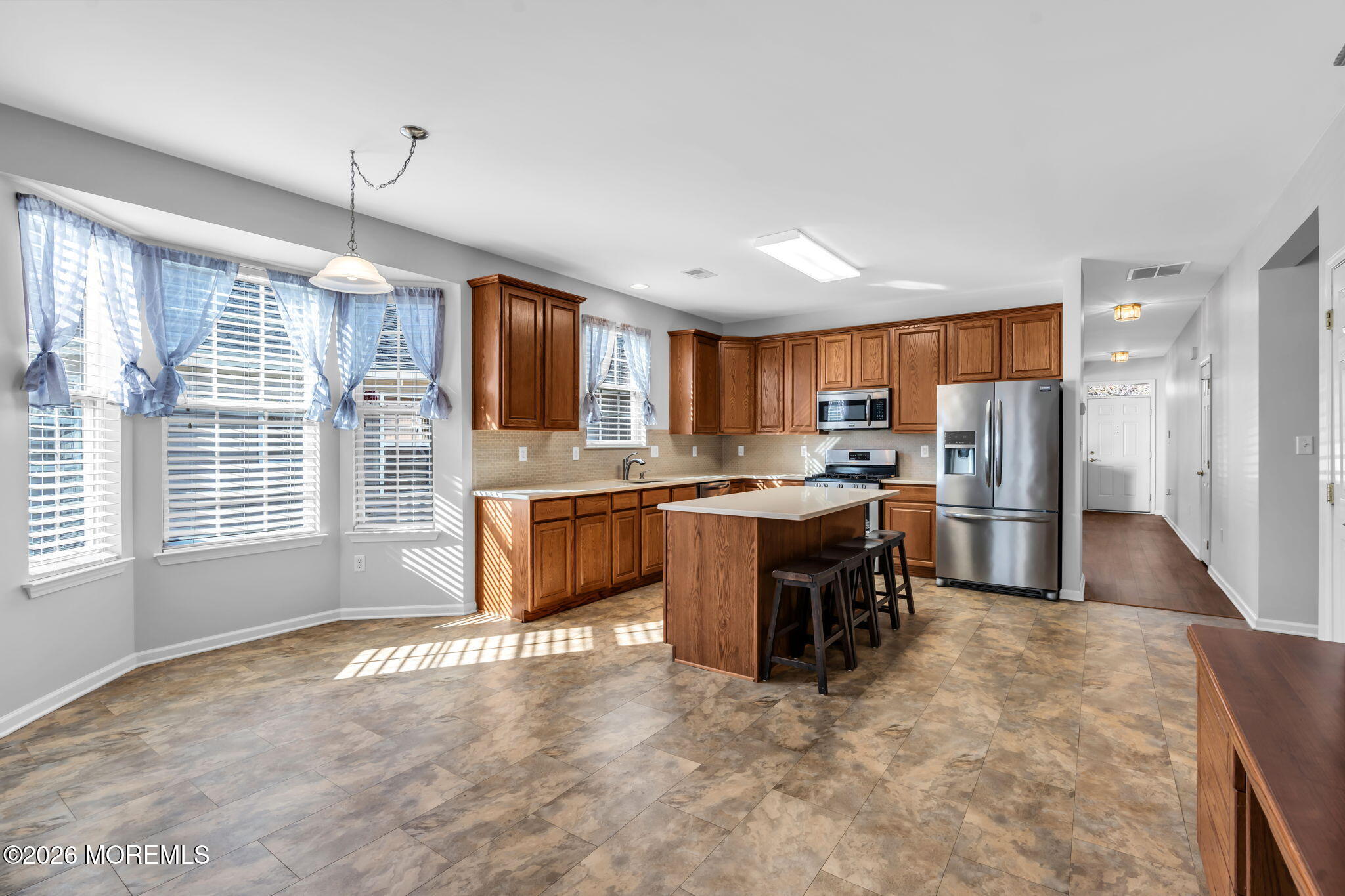 18 Hartack Road Manalapan, NJ 07726 - Photo 15 of 36 a kitchen with refrigerator cabinets and a sink