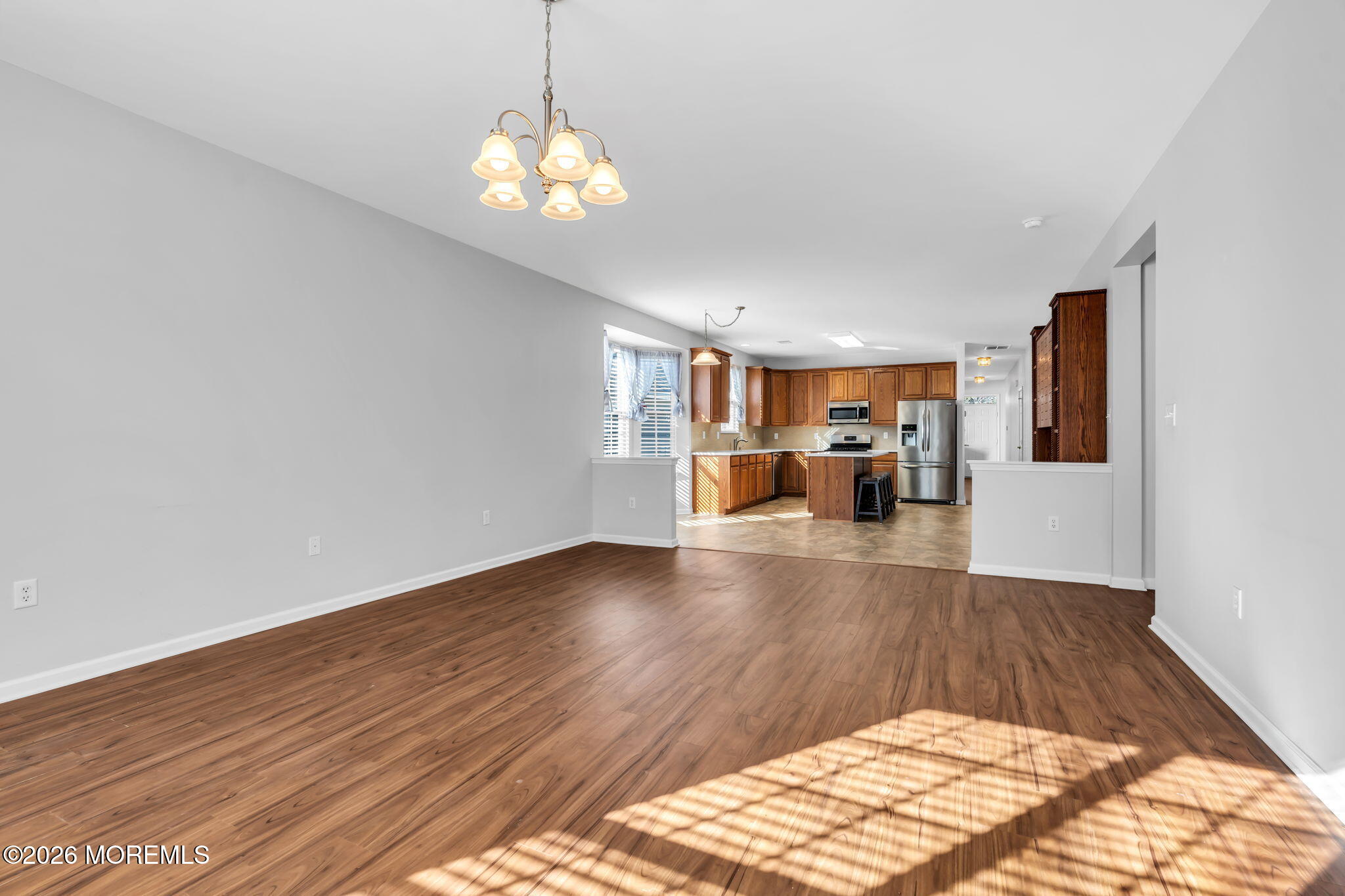 18 Hartack Road Manalapan, NJ 07726 - Photo 19 of 36 a view of livingroom with hardwood floor and a ceiling fan