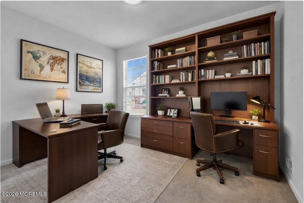 18 Hartack Road Manalapan, NJ 07726 - Photo 28 of 36 a view of a workspace with a bookshelf