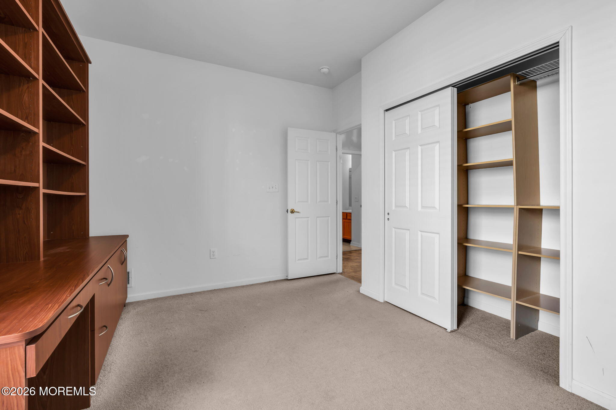18 Hartack Road Manalapan, NJ 07726 - Photo 29 of 36 a view of an empty room with empty shelves
