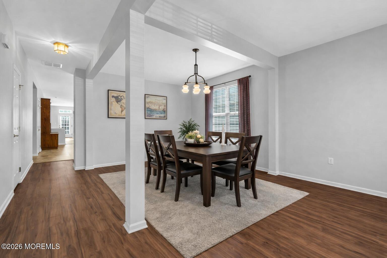 18 Hartack Road Manalapan, NJ 07726 - Photo 3 of 36 a view of a a dining room with furniture window and wooden floor