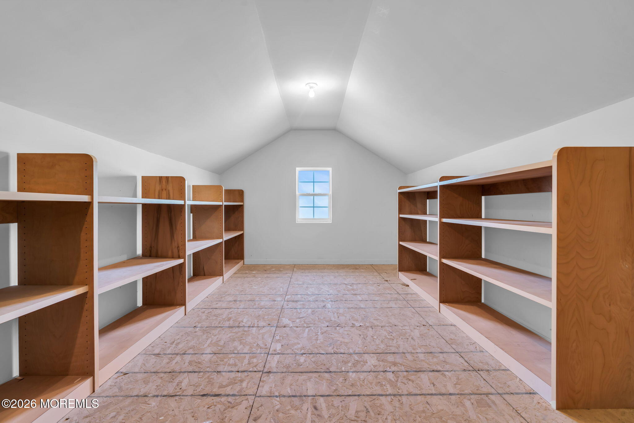 18 Hartack Road Manalapan, NJ 07726 - Photo 33 of 36 a view of an empty room with shelves and a window