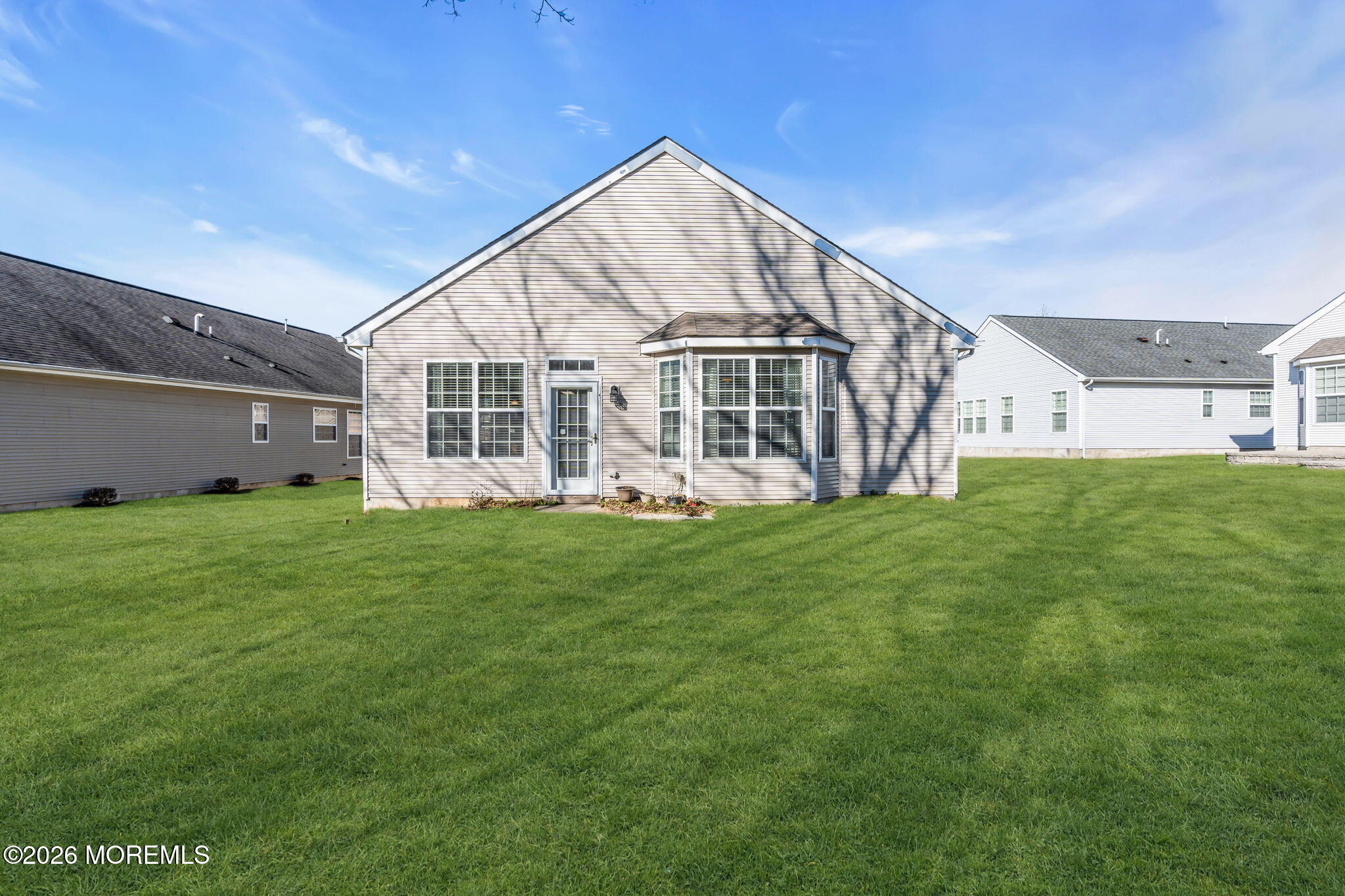 18 Hartack Road Manalapan, NJ 07726 - Photo 34 of 36 a view of a house with a yard and sitting area