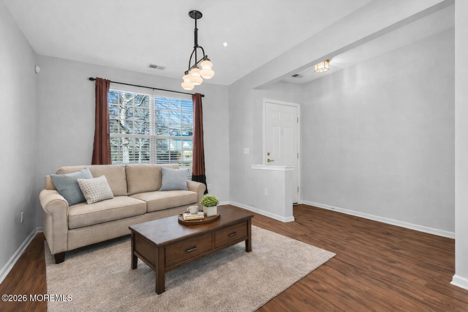 18 Hartack Road Manalapan, NJ 07726 - Photo 5 of 36 a living room with furniture and a large window