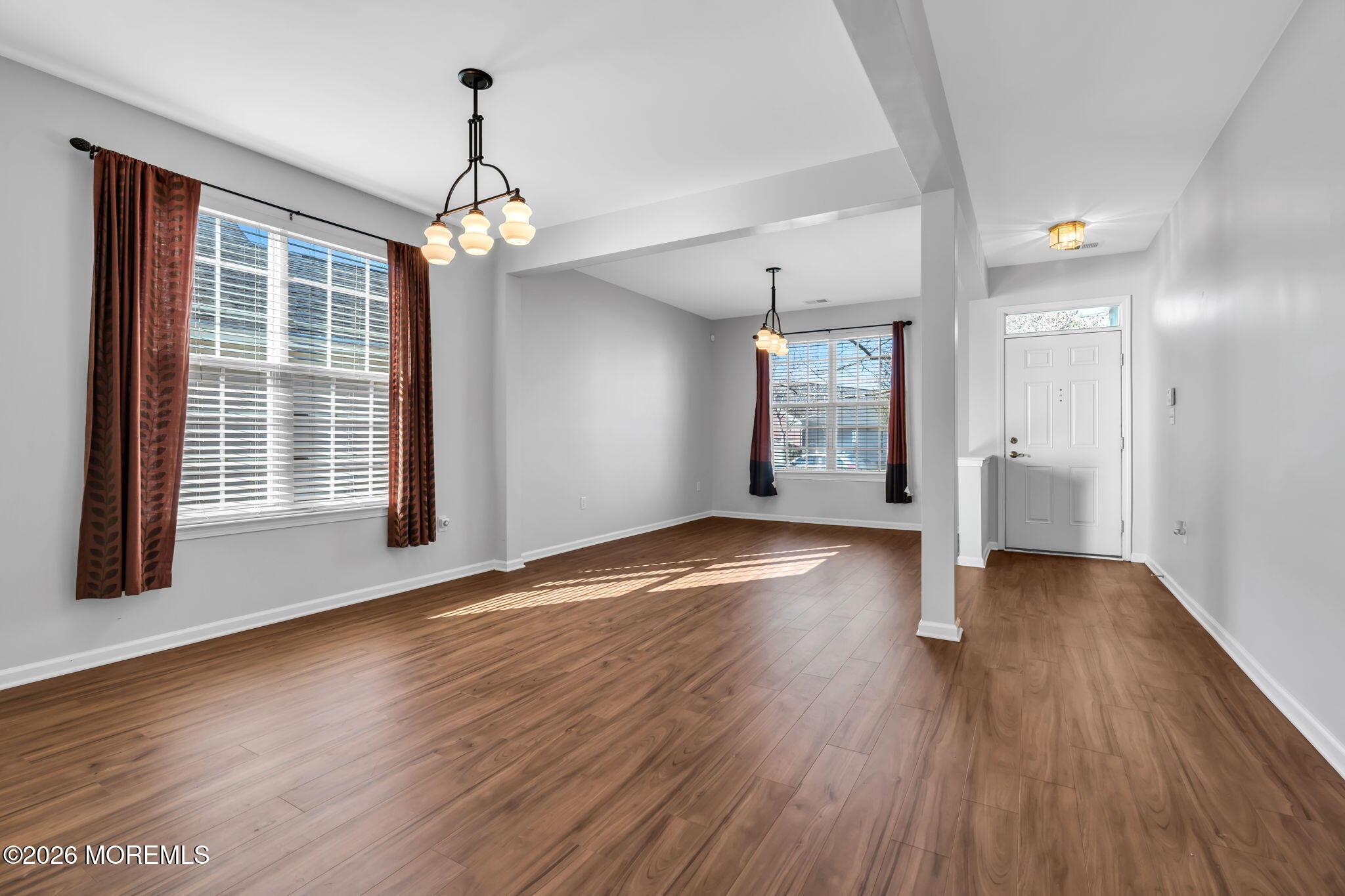 18 Hartack Road Manalapan, NJ 07726 - Photo 9 of 36 a view of an empty room with wooden floor and a window