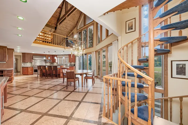 a kitchen with granite countertop a sink a stove and cabinets